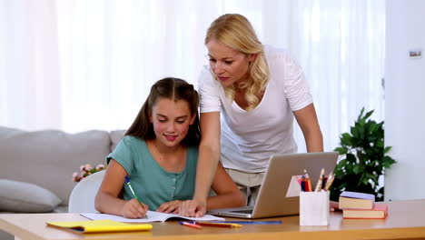 Mother-helping-her-daughter-with-homework