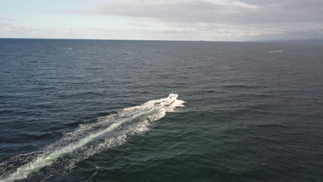 aerial view of a speedboat going forward in the sea