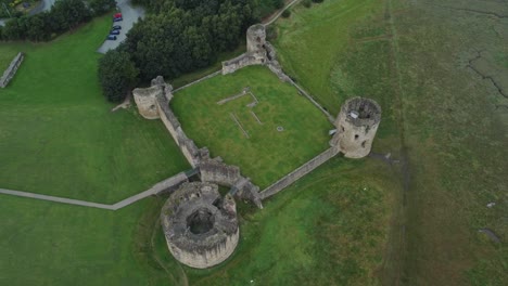 flint castle welsh medieval coastal military fortress ruin aerial view high angle top down right rotation