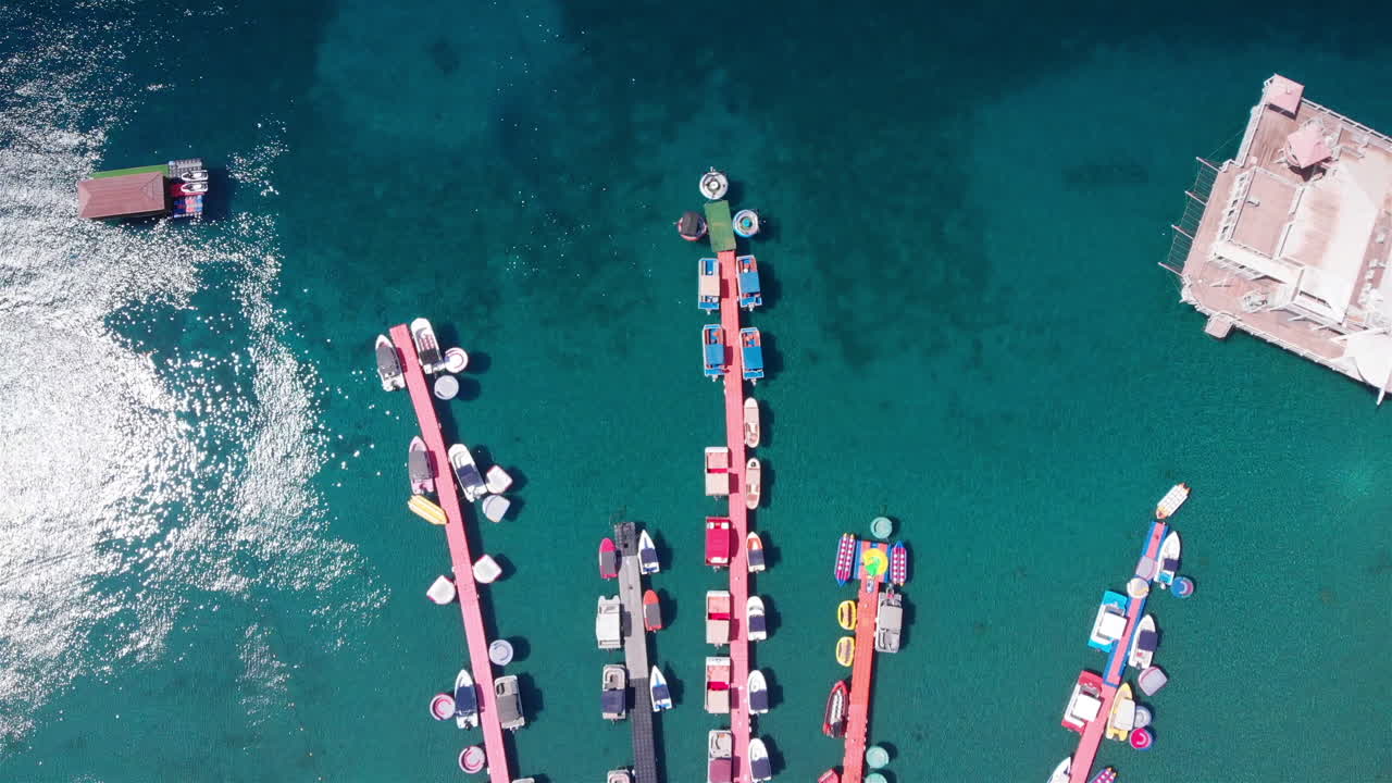 Aerial Footage over Deck Marina With Speed boats Top Down view