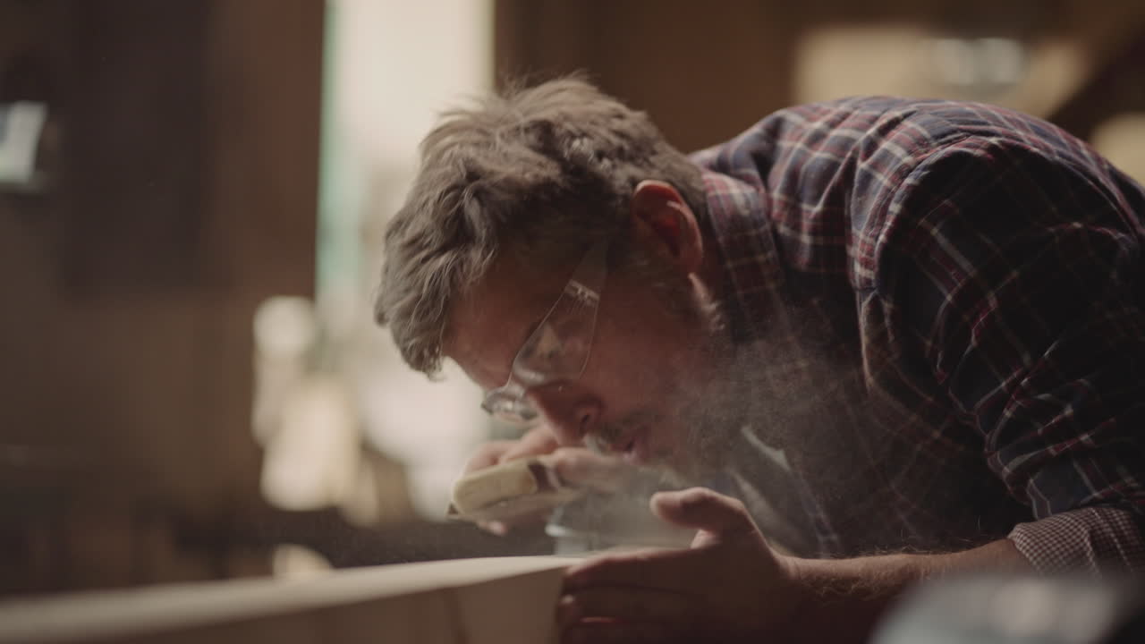 Carpenter sanding wood