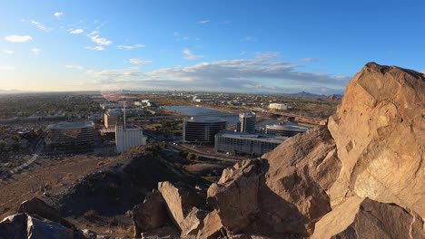 the view from a rocky peak towering over the city of tempe