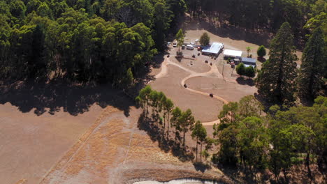 Aerial-view-around-of-a-quad-bike-track-sunny-day-in-Australia-orbit,-drone-shot