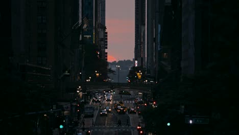 sunset during rush hour traffic in the crowded new york city at manhattanhenge