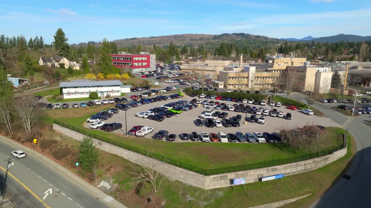 Mission, British Columbia, Canada - Mission Memorial Hospital Stands Nestled Among Trees and Hills, With Easy Access and Spacious Parking - Aerial Drone Shot