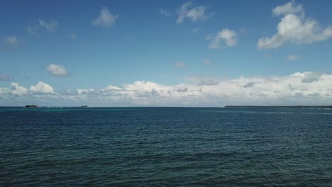 pullback aerial view over the majestic ocean in brgy. santa fe, general luna, siargao