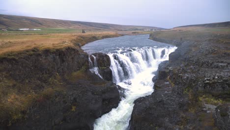 kolugljufur waterfall canyon and river valley countryside in iceland