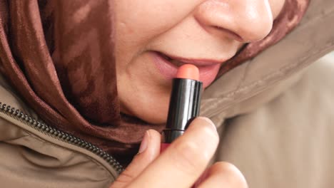 woman applying lipstick