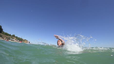 girl swims in the sea on a rubber ring