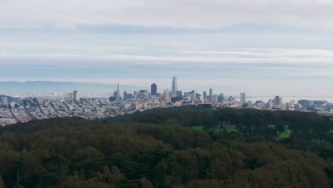 Dramatic-drone-shot-flying-in-towards-downtown-san-francisco-on-gloomy-day