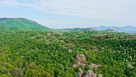 aerial over belogradchik sandstone rock formations amid balkan forestry landscape