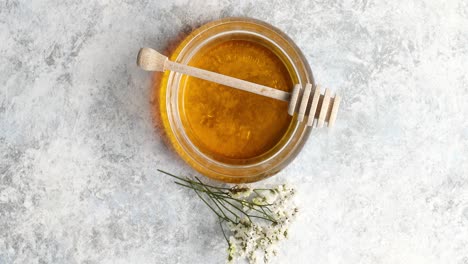 bowl of honey with spindle