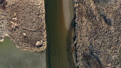 River-during-dry-season.-Aerial-top-down-forward