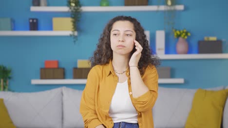 Thoughtful-young-woman-towards-camera-comes-up-with-an-idea.