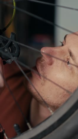 man repairing a bicycle