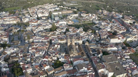 top down view over orgiva town in spain, drone pulling away and rising