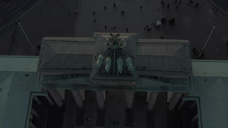 AERIAL:-Overhead-Birds-View-on-Brandenburg-Gate-with-Quadriga-Green-Statue-in-Berlin,-Germany