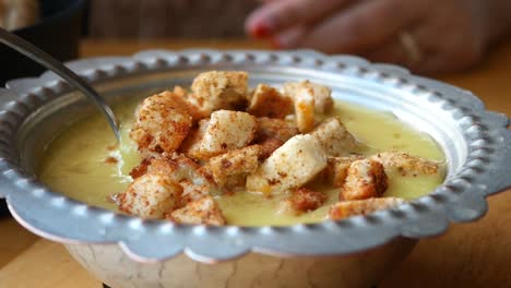 turkish soup with croutons, being eaten