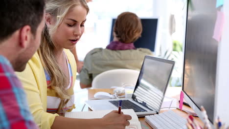 Pair-of-designers-working-together-on-a-sketch