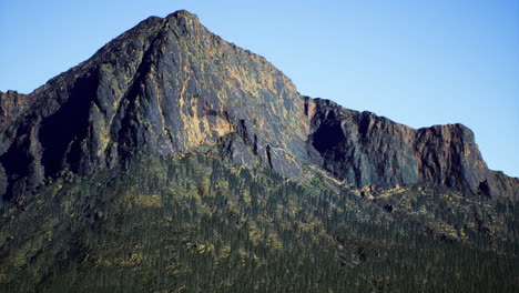 mountain peak stands tall against a clear blue sky showcasing nature