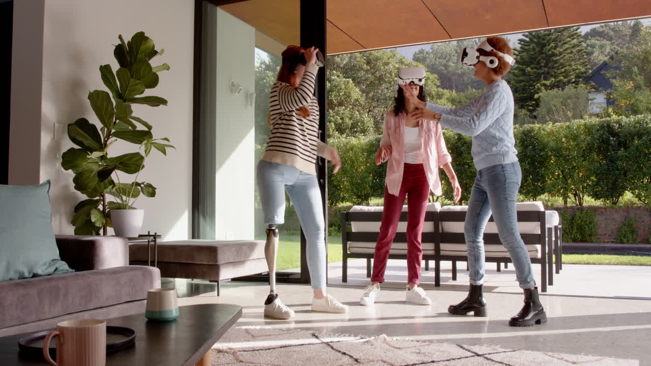Using VR headsets, diverse female friends enjoying virtual reality experience together