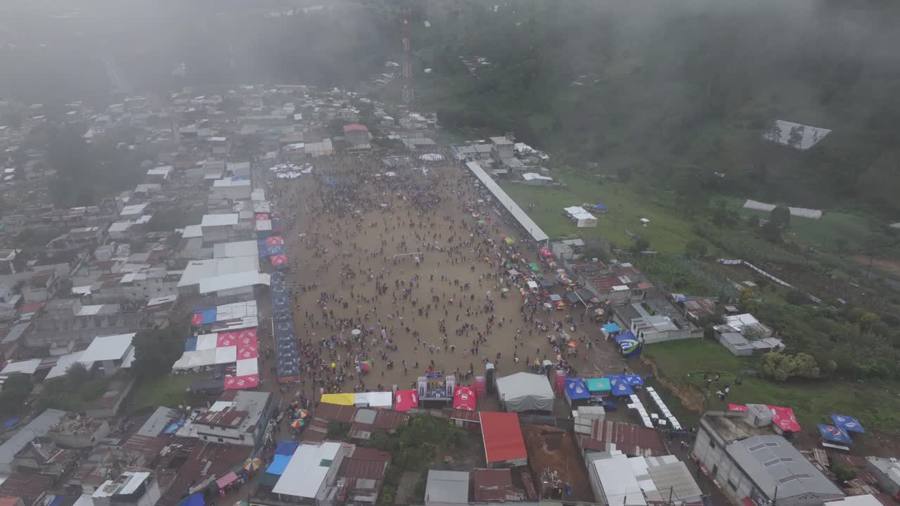 Flying Giant Kites During All Saint's Day cloudy day in Sumpango, aerial