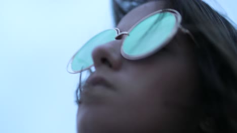 girl wearing fun big round sunglasses