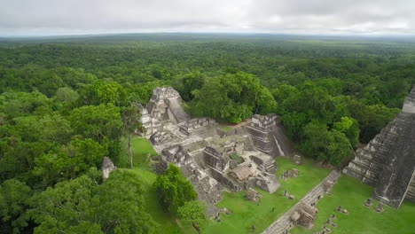 great aerial shot over the tikal pyramids in guatemala 9