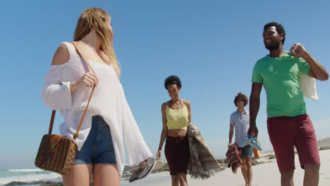 group friends walking together at beach 4k