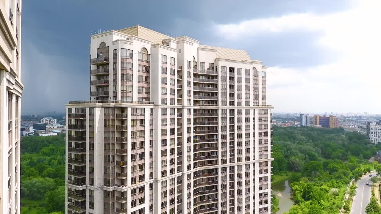 Sunlight plays across the Scyscraper on Harrison Garden Boulevard in Toronto. Time Lapse.