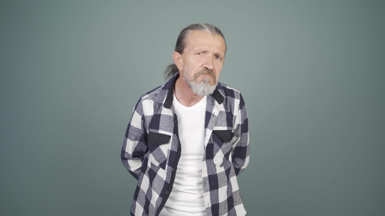 Man looking at camera with curious expression.