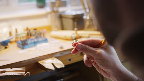 Close-Up-Of-Male-Jeweller-Sketching-Out-Design-For-Ring-In-Studio