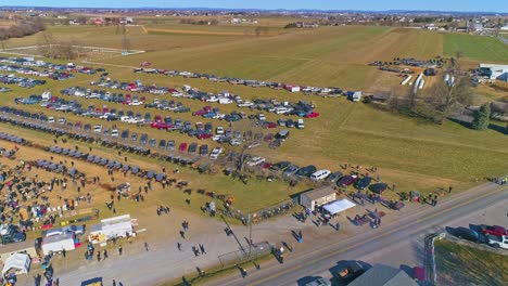 an aerial view of an amish mud sale in pennsylvania selling amish products on a sunny day