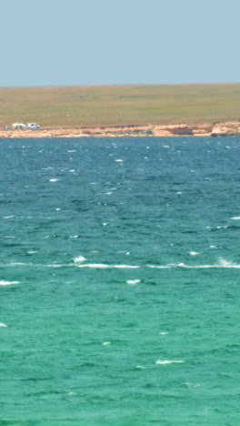 windsurfing on a turquoise sea