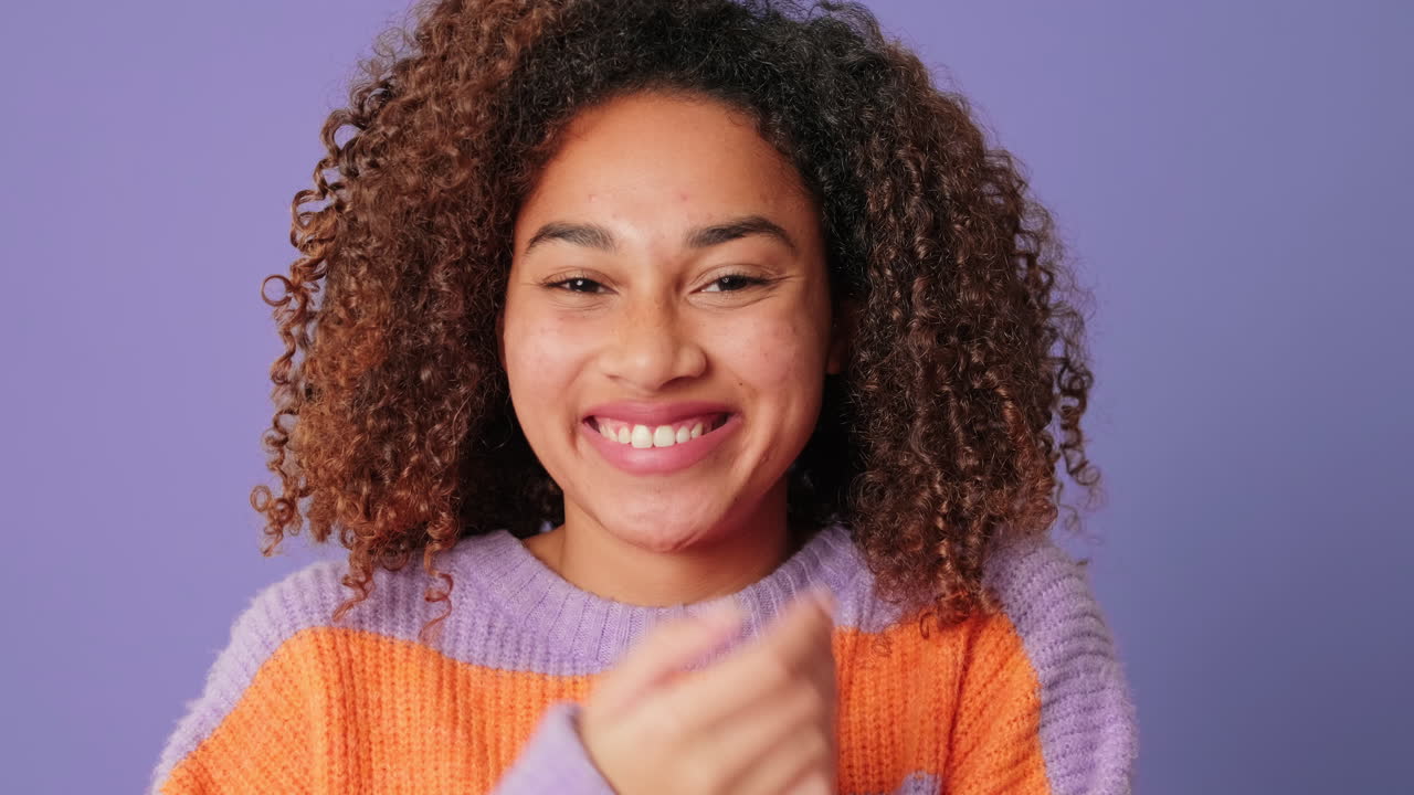 Happy Young Woman with Curly Hair Laughing and Smiling