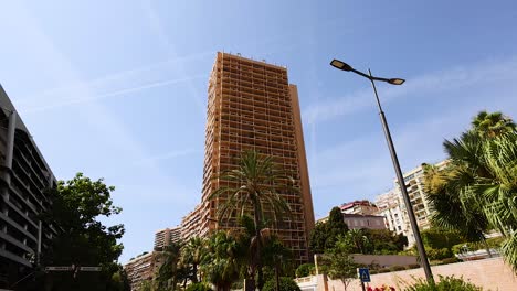 a street scene with buildings and greenery