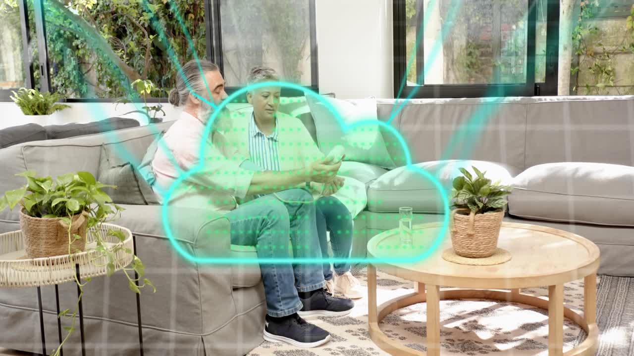 Man showing white health device on woman's forearm on sofa adjusting cuff while cloud syncing data