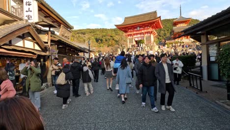 crowded street with tourists and traditional shops