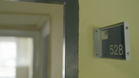 room 528 doorplate in a corridor
