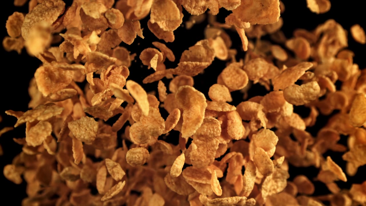 Golden Cornflakes Falling in Super Slow Motion