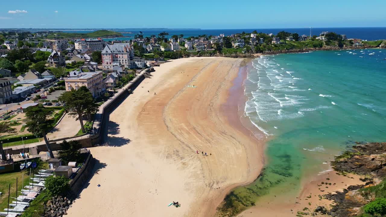 Amazing drone view about the resort part of Saint-Lunaire settlement coastline with calm waves and seaside houses, Saint-Lunaire Beach, Bretagne, France.