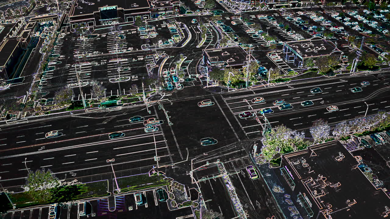 Vehicle traffic at a busy intersection with an artsy x-ray style effect - aerial stationary