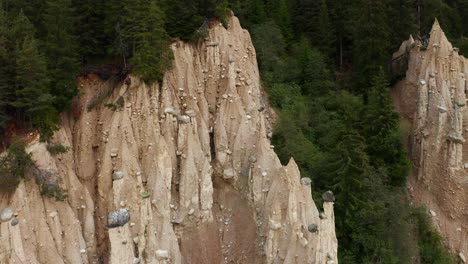 Aerial-View-Of-Piramidi-Di-Terra-With-Forest-Trees-Around-Them