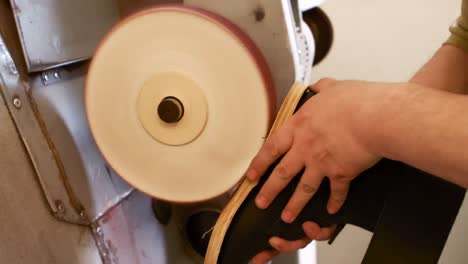 cobbler making a shoe