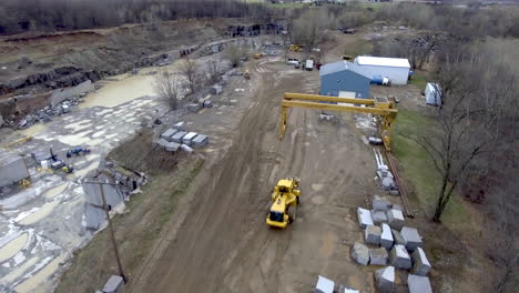 aerial shot of big loader truck in granite quarry