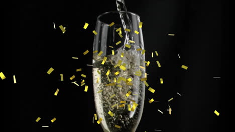 Animation-of-confetti-falling-over-champagne-glass