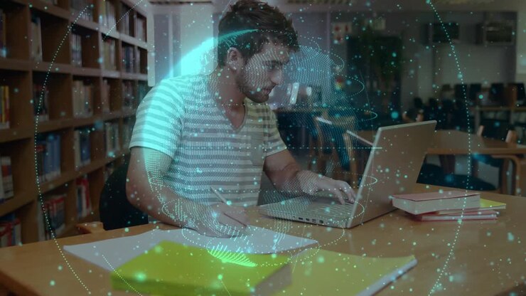 Male student writing notes and typing laptop for education, generating swirling holographic sphere
