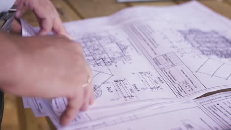 person reviewing building plans