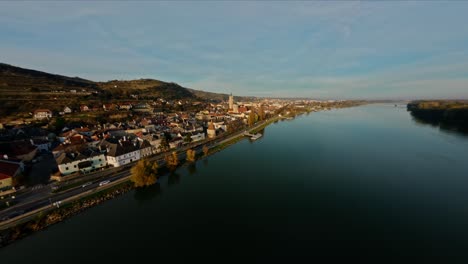 FPV-hovering-over-Danube,-approaching-"Frauenberg-Church",-Stein,-Austria