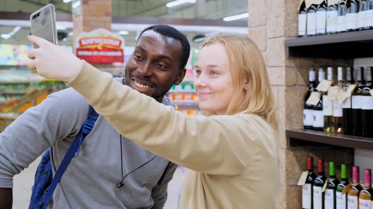 Couple taking a selfie in a grocery store